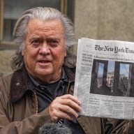 Steve Bannon holding up newspaper