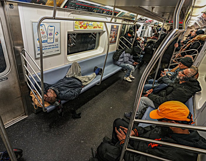 Straphangers say they commute in rush hour alongside sleeping homeless.