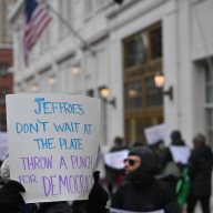 Protestors protest in front of Hakeem Jeffries' office denouncing President Trump, Elon Musk and calling for a removal of Mayor Eric Adams.