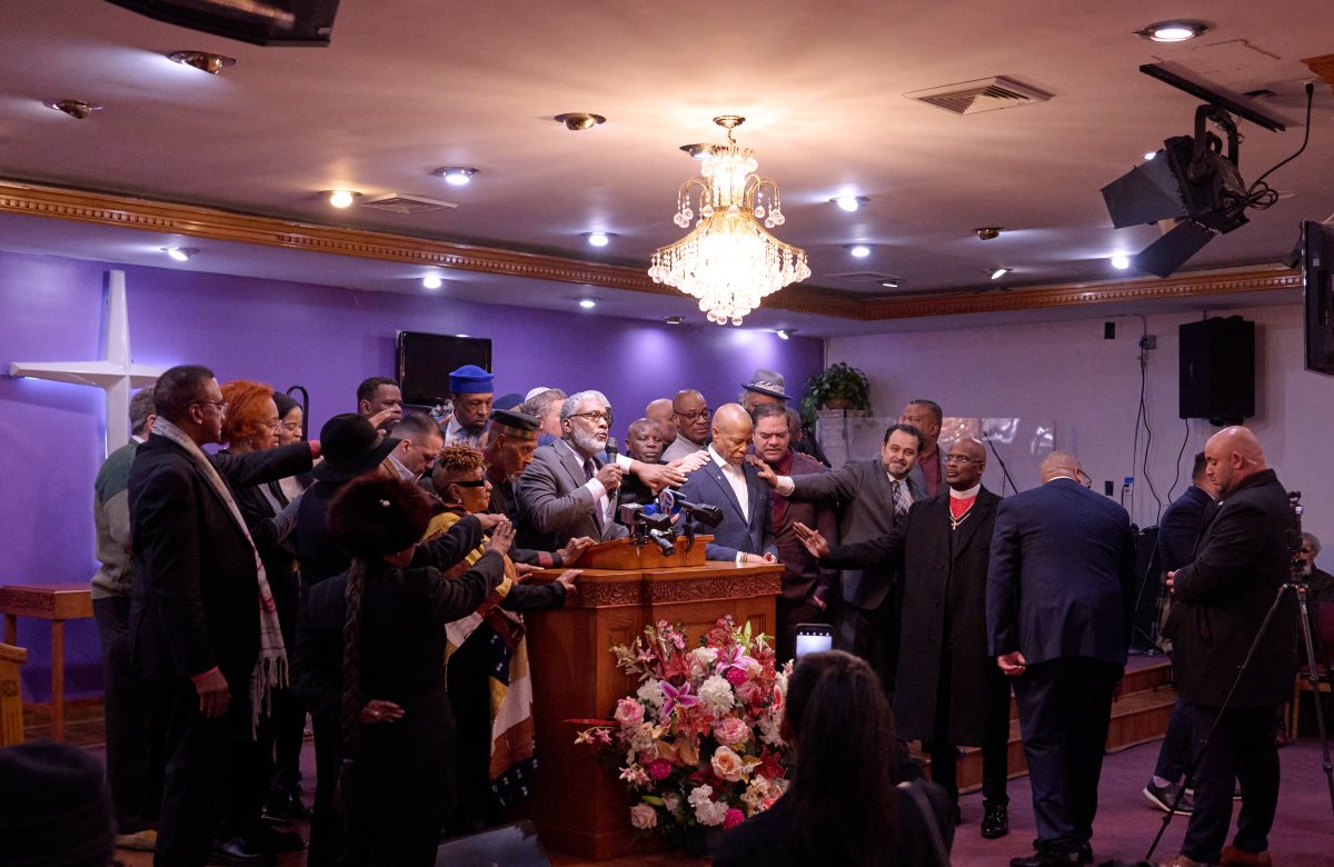 Mayor Adams praying with Brooklyn church congregants