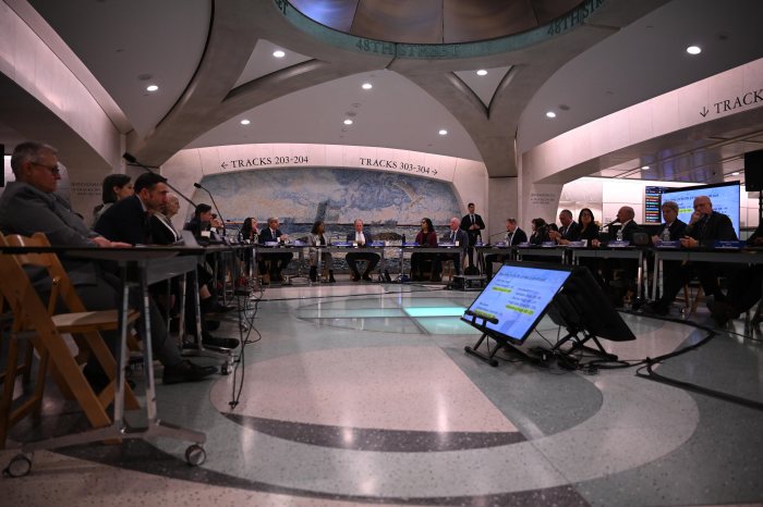 people around a table in Grand Central Station 