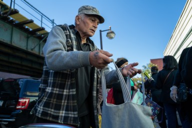 Man getting food at NYC food pantries