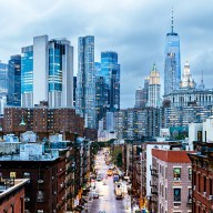 Illuminated Manhattan Financial District skyscrapers seen from Chinatown, New York City, USA