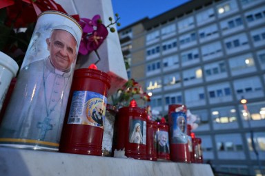 Candles with Pope Francis' image outside Rome hospital