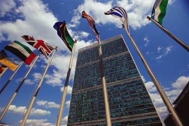 Flags fly outside the General Secretariat Building at the United Nations Headquarters.