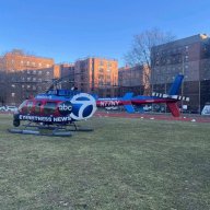 helicopter on a field outside a high school in Queens