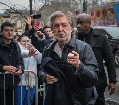 Paul McCartney pointing at cameraman on Lower East Side