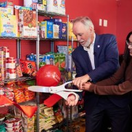 CUNY Chancellor Félix V. Matos Rodríguez and Macaulay Scholars Council President Shania Persaud open the food pantry.