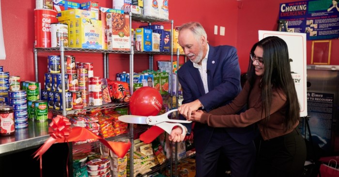 CUNY Chancellor Félix V. Matos Rodríguez and Macaulay Scholars Council President Shania Persaud open the food pantry.