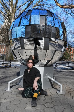 Artist Ryan Van Der Hout with disco ball creation at Washington Square Park