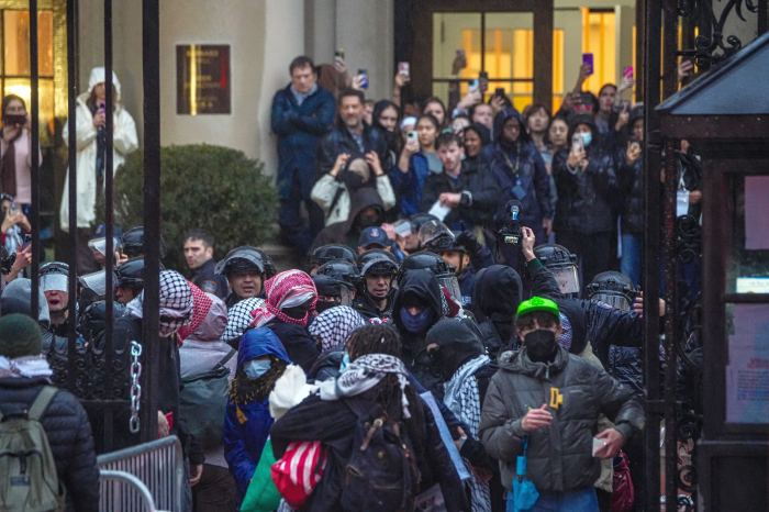 people outside at a protest at Barnard College