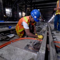 MTA workers building rail as part of capital plan