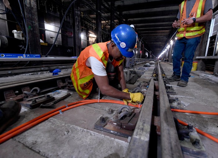 MTA workers building rail as part of capital plan