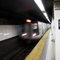 J train pulling into Manhattan subway station