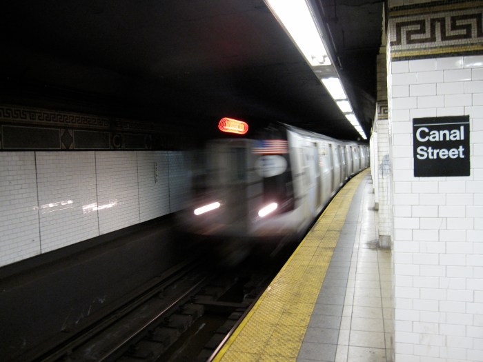 J train pulling into Manhattan subway station