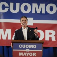 Andrew Cuomo speaking at podium in NYC mayoral race