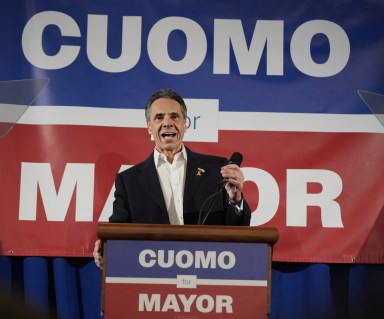 Andrew Cuomo speaking at podium in NYC mayoral race