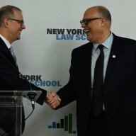 City Comptroller candidates Mark Levine and Justin Brannan shaking hands