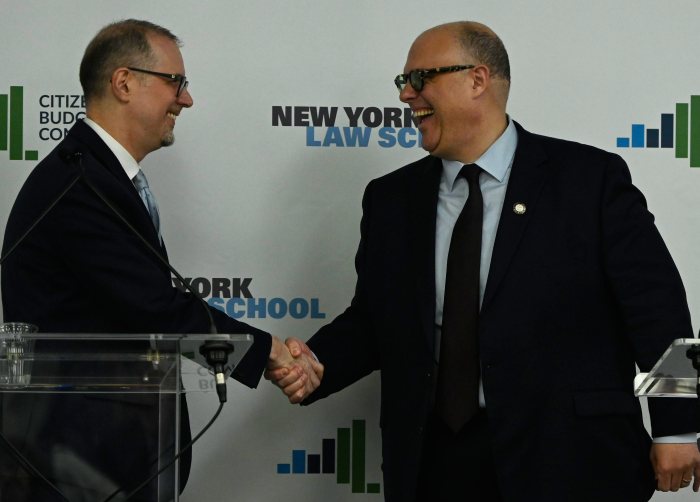 City Comptroller candidates Mark Levine and Justin Brannan shaking hands