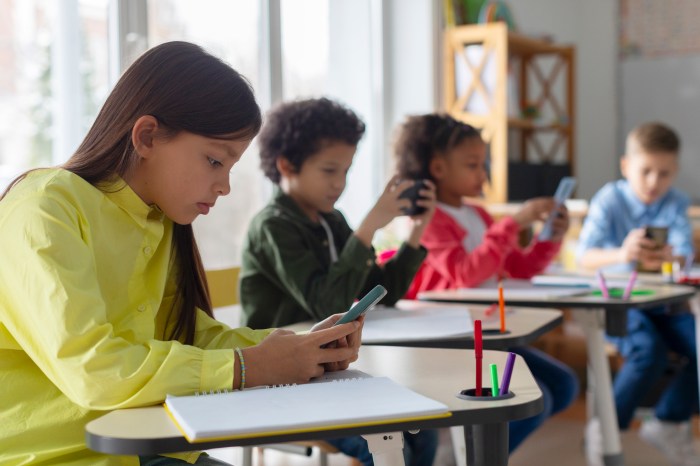 Students on cell phones in schools