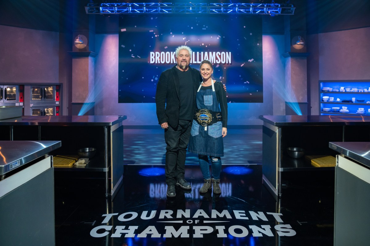 Host Guy Fieri with winning competitor Brooke Williamson, as seen on Tournament of Champions, Season 1.