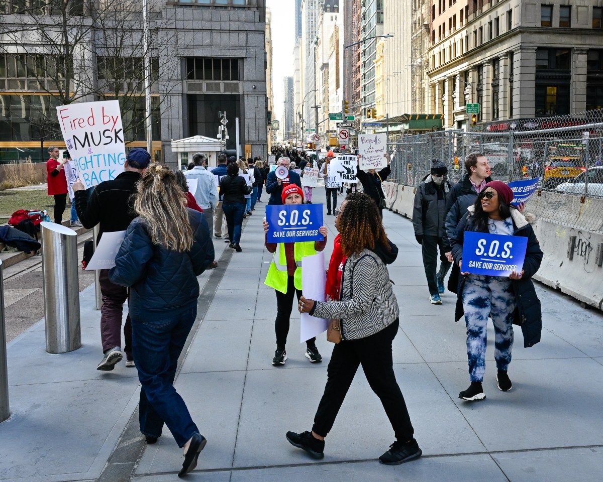 Federal workers and allies protested outside the Jacob K. Javits Federal Building against the massive DOGE firings. Photo by Gabriele Holtermann