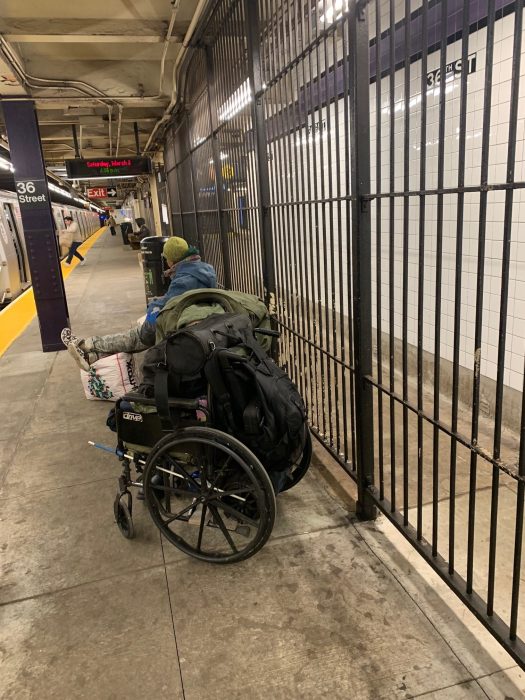 two homeless people on NYC trains platform